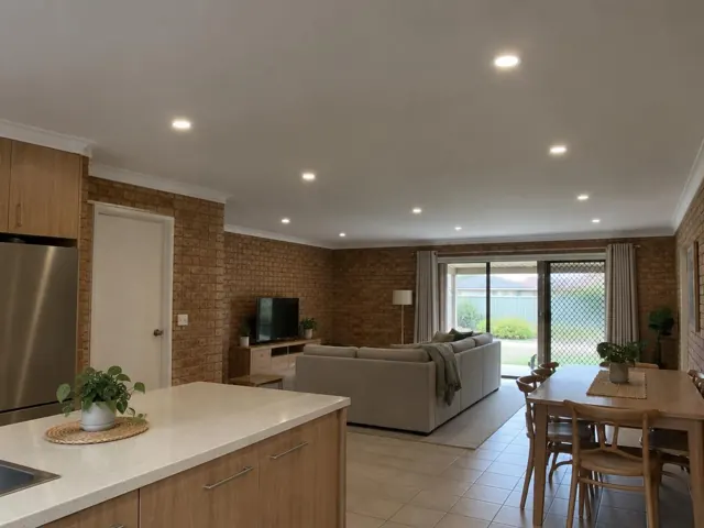 Open-plan kitchen dining and living room with recessed ceiling downlights and tiled floor in Toukley